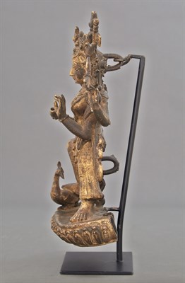 Lot 96 - Tibetan Gilt-Bronze Deity The figure standing...