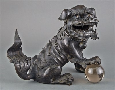 Lot 126 - Chinese Bronze Fu Lion Seated with the front...