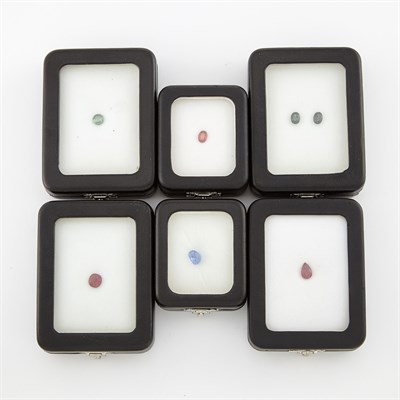 Lot 2114 - Three Unmounted Sapphires and Three Unmounted Rubies