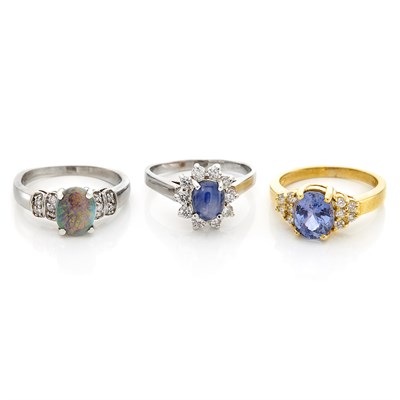 Lot 1294 - Three Yellow and White Gold, Diamond, Opal, Star Sapphire, and Sapphire Rings