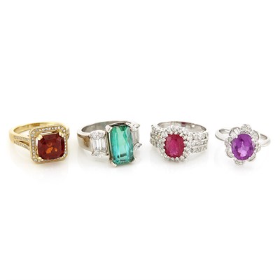 Lot 1379 - Four Yellow and White Gold, Diamond and Colored Stone Rings