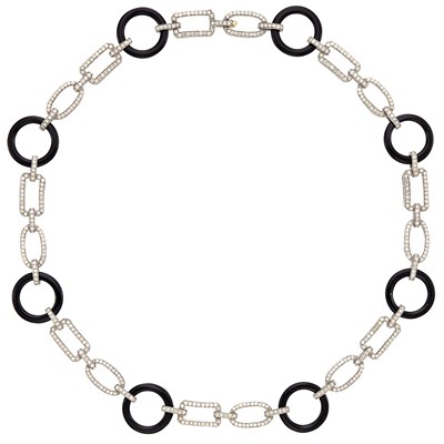 Lot 1251 - Blackened Gold, Black Onyx and Diamond Necklace