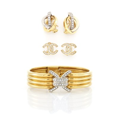 Lot 1650 - Two-Color Gold and Diamond Bangle Bracelet and Two Pairs of Earrings