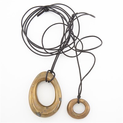 Lot 1810 - Two Bronze Pendants with Leather Cord Necklace