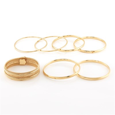 Lot 1972 - Six Gold Bangle Bracelets and Wide Gold Bracelet