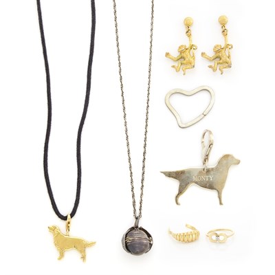 Lot 1310 - Gold Dog Pendant, Sterling Silver Dog Key Charm, Tiffany & Co., Silver Ball Locket with Chain, Two Rings and Pair of Monkey Pendant-Earrings