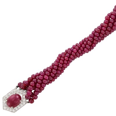 Lot 328 - Seven Strand Ruby Bead Torsade Bracelet with White Gold, Cabochon Ruby and Diamond Clasp