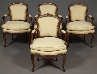 Lot 479 - Set of Four Louis XV Walnut Open Armchairs...