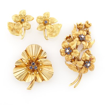 Lot 1447 - Two Gold, Sapphire and Diamond Flower Brooches, Tiffany & Co., and Pair of Gold and Sapphire Earrings
