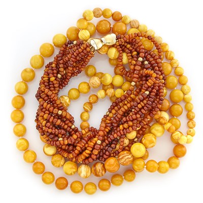 Lot 1650 - Two Long Butterscotch Amber Bead Necklaces and Multistrand Amber and Gold Bead Necklace with Two-Color Gold Clasp