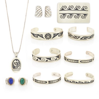 Lot 1401 - Six Silver Southwestern Cuff Bracelets, Belt Buckle, Pendant with Chain Necklace, and Two Rings and Pair of Earrings