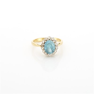 Lot 1184 - Gold, Blue Zircon and Diamond Ring
