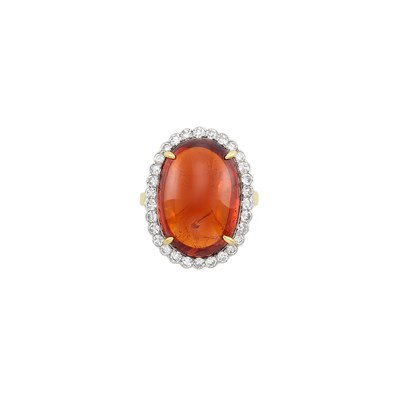 Lot 285 - Two-Color Gold, Cabochon Spessartite Garnet and Diamond Ring