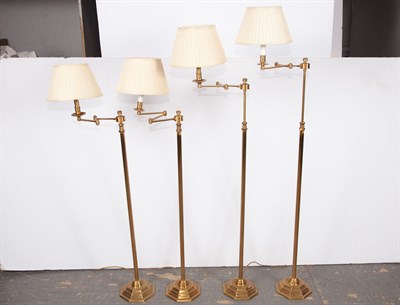 Lot 180 - Group of Four Brass Swing-Arm Floor Lamps