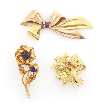 Lot 1265 - Gold and Cabochon Ruby Leaf Bouquet Brooch, Tiffany & Co., Gold and Lapis Double Rose Brooch and Two-Color Gold Bow Brooch
