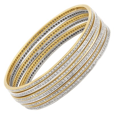 Lot 552 - Six Yellow and White Gold and Diamond Bangle Bracelets