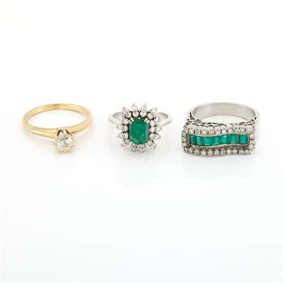 Lot 1812 - Three Gold, White Gold, Emerald, Synthetic Emerald and Diamond Rings