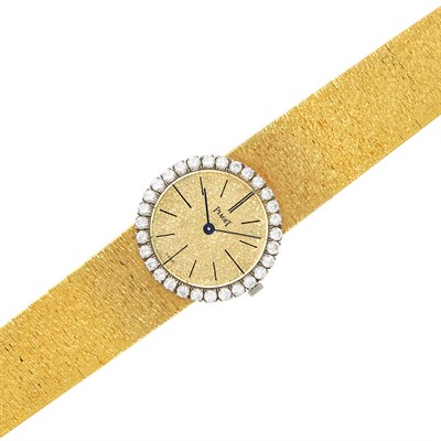 Lot 57 - Two-Color Gold and Diamond Wristwatch, Piaget