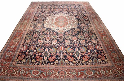 Lot 589 - Heriz Carpet Northwest Persia, circa 1900 The...