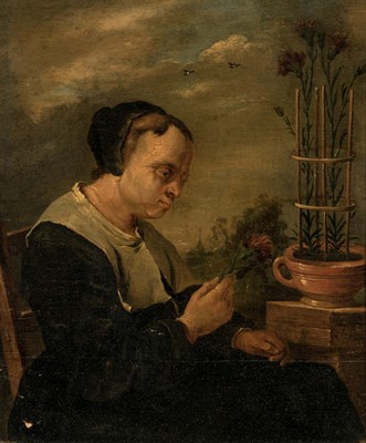 Lot 12 - Follower of David Teniers the Younger A Woman...