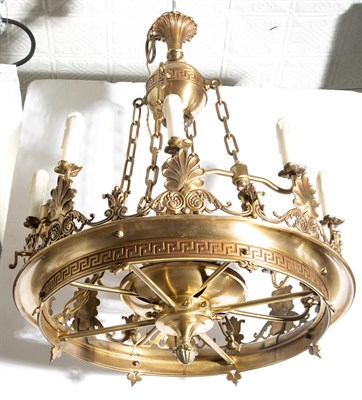 Lot 358 - Empire Style Brass Eight-Light Chandelier...