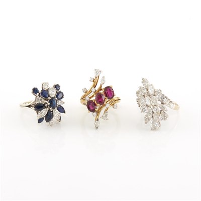 Lot 2028 - Three Two-Color Gold, Diamond, Ruby and Sapphire Cluster Rings