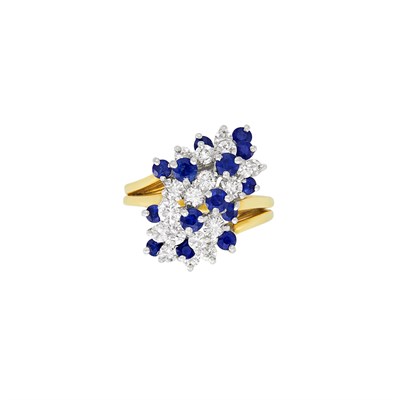 Lot 292 - Two-Color Gold, Diamond and Sapphire Cluster Ring