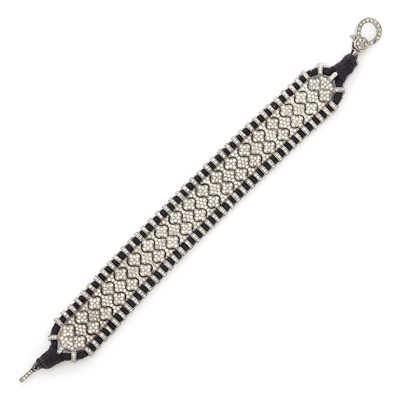 Lot 1561 - Blackened Gold, Diamond and Black Cord Bracelet