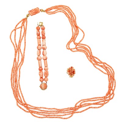Lot 324 - Long Five Strand Angel Skin Coral Bead Necklace, Double Strand Bracelet and Carved Coral and White Coral Bead Ring