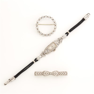 Lot 1889 - Platinum and Diamond Bow Brooch, J.E. Caldwell & Co., Wristwatch, and Circle Pin