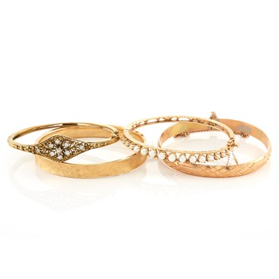 Lot 1331 - Four Gold, Diamond and Pearl Bangle Bracelets