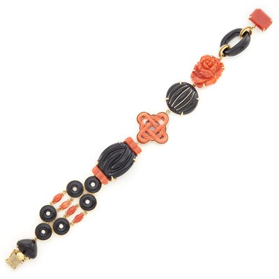 Lot 1102 - Gold, Carved Black Onyx and Coral and Diamond Link Bracelet