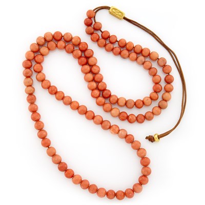 Lot 1005 - Gold and Coral Bead Necklace on Leather Cord, Linda Lee Johnson