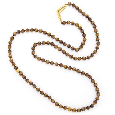 Lot 1034 - Long Tiger's Eye and Gold Bead Necklace, Linda Lee Johnson