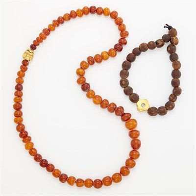 Lot 1010 - Amber Bead Necklace with Gold Bee Clasp, Linda Lee Johnson, and Wood Bead, Gold and Diamond Bracelet, by Linda Lee Johnson