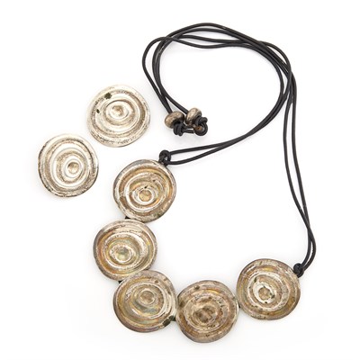 Lot 1078 - Silver Swirl Disc Necklace on Cord and Pair of Earclips, Linda Lee Johnson