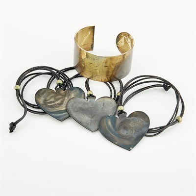 Lot 1089 - Three Silver 'Folded Heart' Pendants on Cord Necklaces and Cuff Bracelet, Linda Lee Johnson
