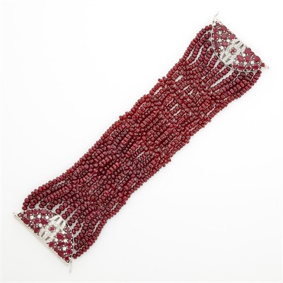 Lot 1566 - Woven Ruby Bead Bracelet with White Gold, Ruby and Diamond Clasp