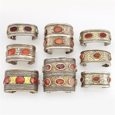 Lot 2156 - Eight Mixed Metal and Carnelian Cuff Bangle Bracelets