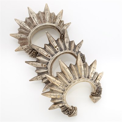 Lot 2186 - Three Mixed Metal Ethnic Bangle Bracelets