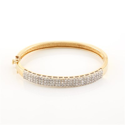 Lot 1877 - Gold and Diamond Bangle Bracelet