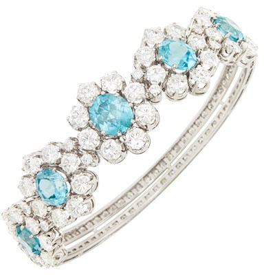 Lot 63 - White Gold, Blue Zircon and Diamond Bangle Bracelet