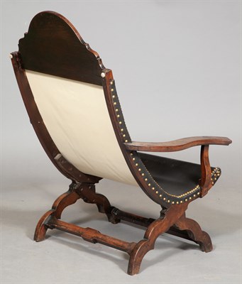 Lot 366 - Campeche Chair The demilune crest, shaped arm...