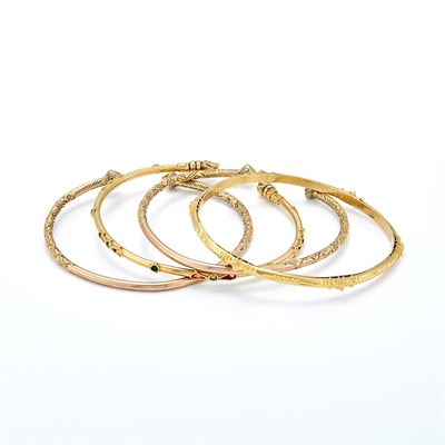 Lot 1488 - Four Gold and Low Karat Gold Bangle Bracelets