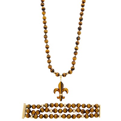 Lot 100 - Tiger's Eye and Gold Bead Fleur-de-Lys Pendant-Necklace and Triple Strand Bracelet