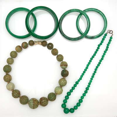 Lot 1716 - Four Dyed Jade and Nephrite Bangle Bracelets and Two Bead Necklaces