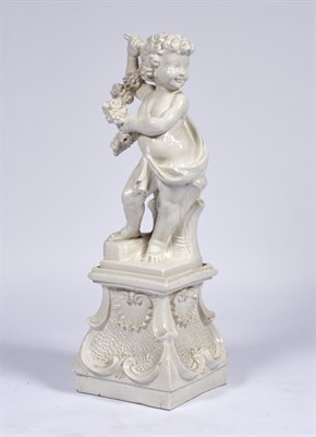 Lot 321 - Italian Porcelain Figure of a Putto on a...