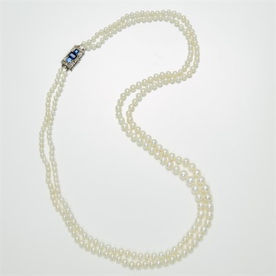 Lot 1202 - Double Strand Cultured Pearl Necklace with White Gold, Sapphire and Diamond Clasp