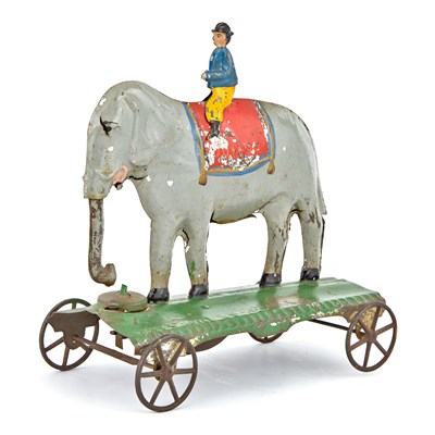Lot 78 - Elephant and Trainer Tin Bell Toy Large...