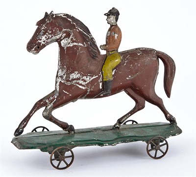 Lot 67 - Horse and Rider Tin Pull Toy Horse in full...